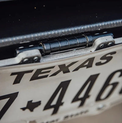 Flip up license plate bracket